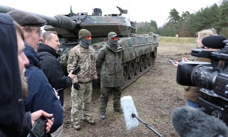 Ukrainian servicemen talk to the media after a training session on Leopard 2 tanks