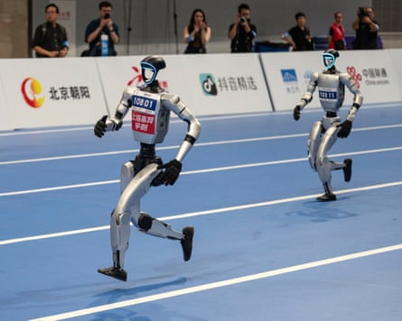 Two humanoid robots compete in the 1500m