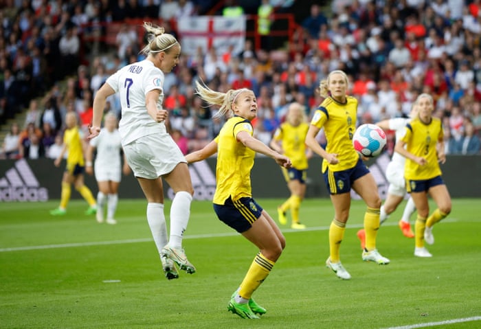 England player Beth Mead approaches with a header.