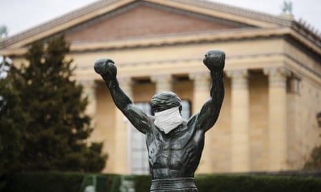 The Rocky statue is outfitted with a mock surgical face mask at the Philadelphia Art Museum in Philadelphia.