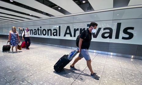 Passengers in the arrivals hall at Heathrow Airport, London
