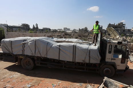 A truck carries aid for Palestinians, amid a ceasefire between Israel and Hamas in Gaza, in Khan Younis, in the southern Gaza Strip on Saturday.