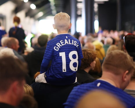 A boy in a Jack Grealish shirt.