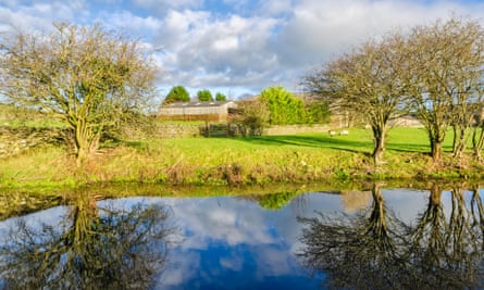Three miles south of the city of Lancaster; Crooklands in Cumbria.