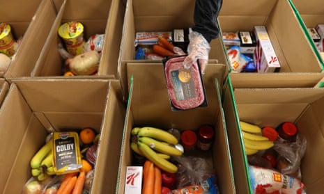 boxes of fruit and packaged food in a food bank