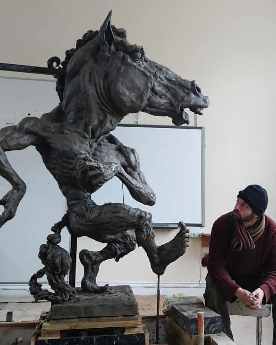 Aidan Harte beside his statue of the Púca at his Dublin studio.