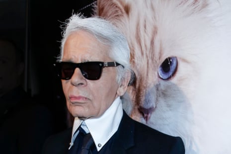 Karl Lagerfeld in front of an image of his cat, Choupette, 2015