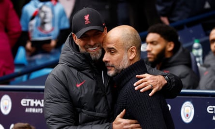 Jürgen Klopp embraces Pep Guardiola on the touchline in April 2023.