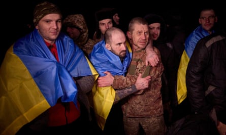 Ukrainian prisoners of war after a swap at an unknown location in Ukraine.]