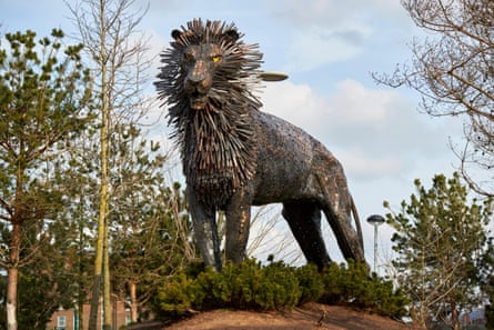 A large metal sculpture of Aslan the lion