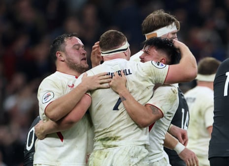 England's Sam Underhill celebrates scoring their second try with Jamie George and Marcus Smith.