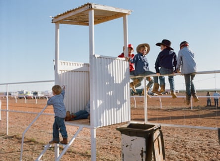 A group of kids play outside in White Cliffs