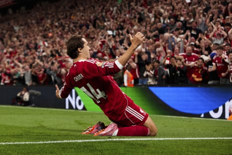 Federico Chiesa celebrates after scoring Liverpool’s third goal a few minutes after coming on as a substitute against Bournemouth last night.