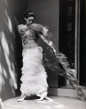 Fashion illustration with model wearing a long feather dress (1961–66).