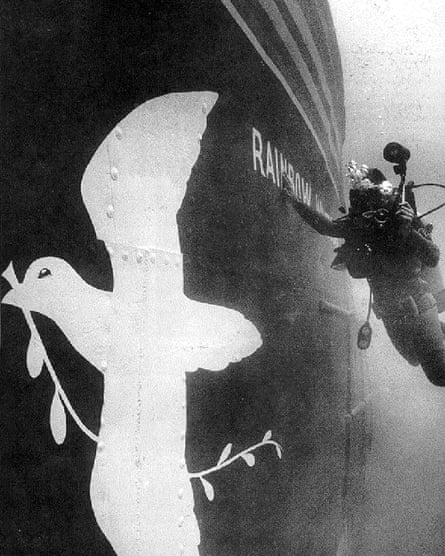 A diver photographing the sunken Rainbow Warrior in July 1985 after it had been bombed by French secret service agents.