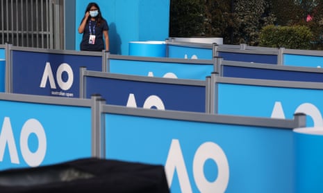 A security guard keeps watch at an entry point to the Australian Open