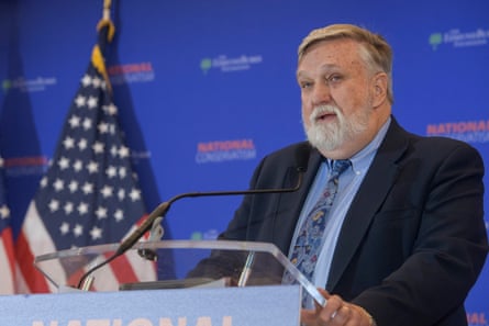a man in front of a microphone