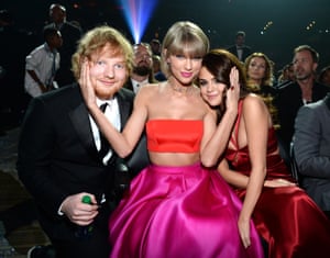 Ed Sheeran, Taylor Swift and Selena Gomez at the ceremony, with Swift apparently asserting ownership of Sheeran and Gomez.