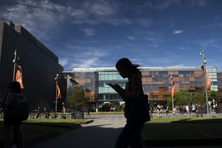 A student walks past buildings at the University of Sydney