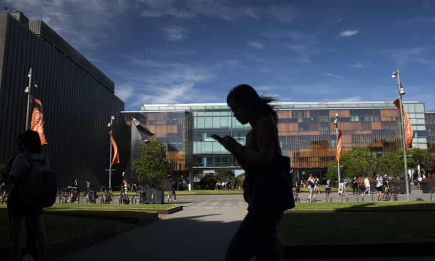 File photo of a student walking past buildings at the University of Sydney