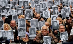 People gather to commemorate the 24th anniversary of the attack on the AMIA community center in Buenos Aires<br>People hold up portraits of victims of the 1994 bombing of the Argentine Israeli Mutual Association (AMIA) community center as they gather to commemorate the 24th anniversary of the attack in Buenos Aires, Argentina, July 18, 2018. REUTERS/Marcos Brindicci NO RESALES. NO ARCHIVES TPX IMAGES OF THE DAY