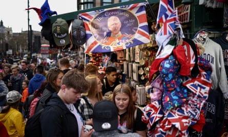 Souvenir merchandise for the coronation of King Charles III on sale at a kiosk outside parliament in London.