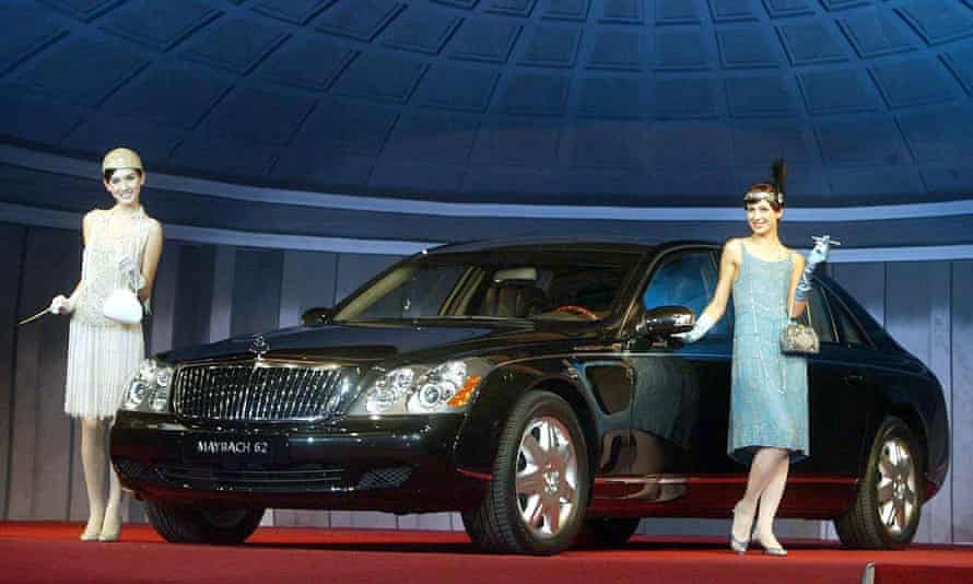 Models pose next to German carmaker Mercedes-Benz’s Maybach 62, during a 2004 unveiling at a hotel in Seoul.