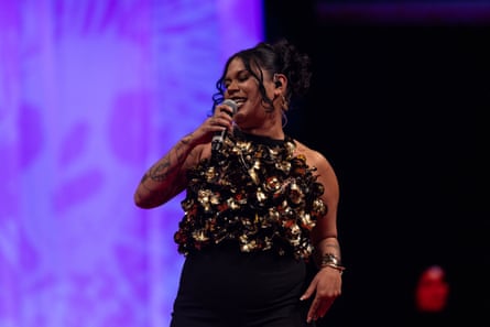Barkaa performs King Brown during Country to Couture wearing gold jacaranda seed top designed by her mother Cleonie Quayle