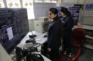 two female Northern Railway staff in an office