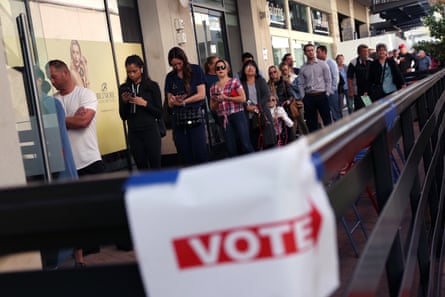 Voters wait to cast their ballots on 8 November 2022 in Phoenix, Arizona.