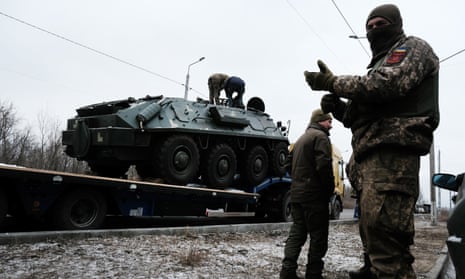 A Ukrainian military vehicle is unloaded on the road to Bakhmut.