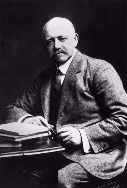 William Willett poses at this desk in 1900