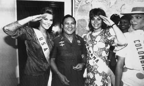 Miss USA, Christy Fichtner, left, and Miss Panama, Gilda García López, salute while flanking Gen Manuel Antonio Noriega in Panama City.