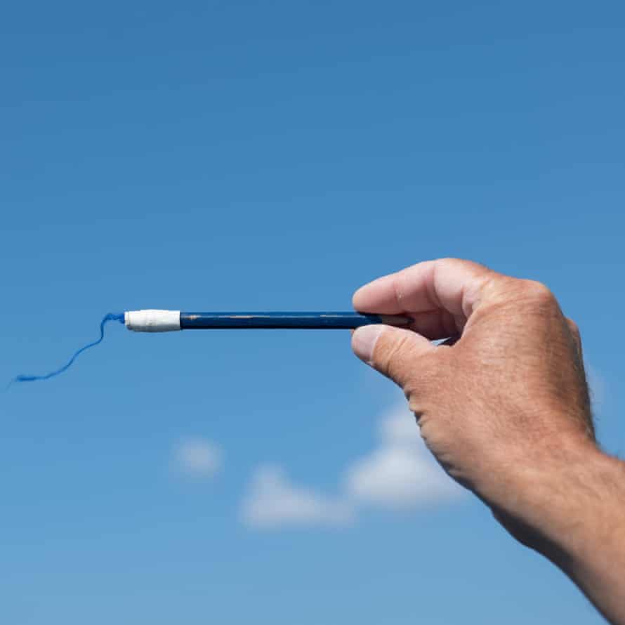 Tom Squires’ coach Dom Tidey testing the wind direction during a training session.