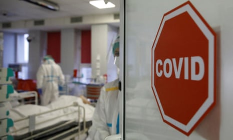 Medical staff treat patients inside the coronavirus ward at a hospital in Warsaw, Poland.