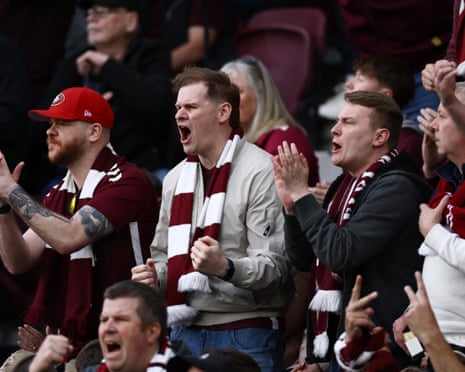Heart of Midlothian fans shout and applaud