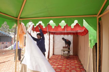Two man take down a tent