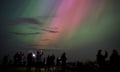 Northern Lights Visible In England<br>WHITLEY BAY, ENGLAND - MAY 10: People visit St Mary's lighthouse in Whitley Bay to see the aurora borealis, commonly known as the northern lights, on May 10, 2024 in Whitley Bay, England. The UK met office said a strong solar storm may allow northern parts of the UK the chance to see displays of aurora. (Photo by Ian Forsyth/Getty Images)