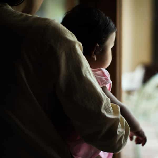 A woman and child seen in profile