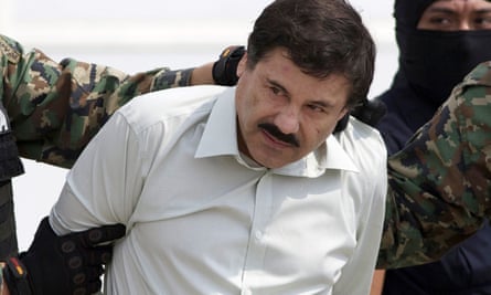 Joaquin ‘El Chapo’ Guzman is escorted to a helicopter in Mexico City.