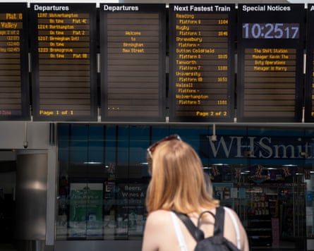 A passenger looks at the departures board at New Street station in Birmingham during a strike in June 2022 by RMT members employed by Network Rail