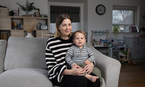 Kirsty Orton and her son, Fynn, sitting on her knee on a sofa