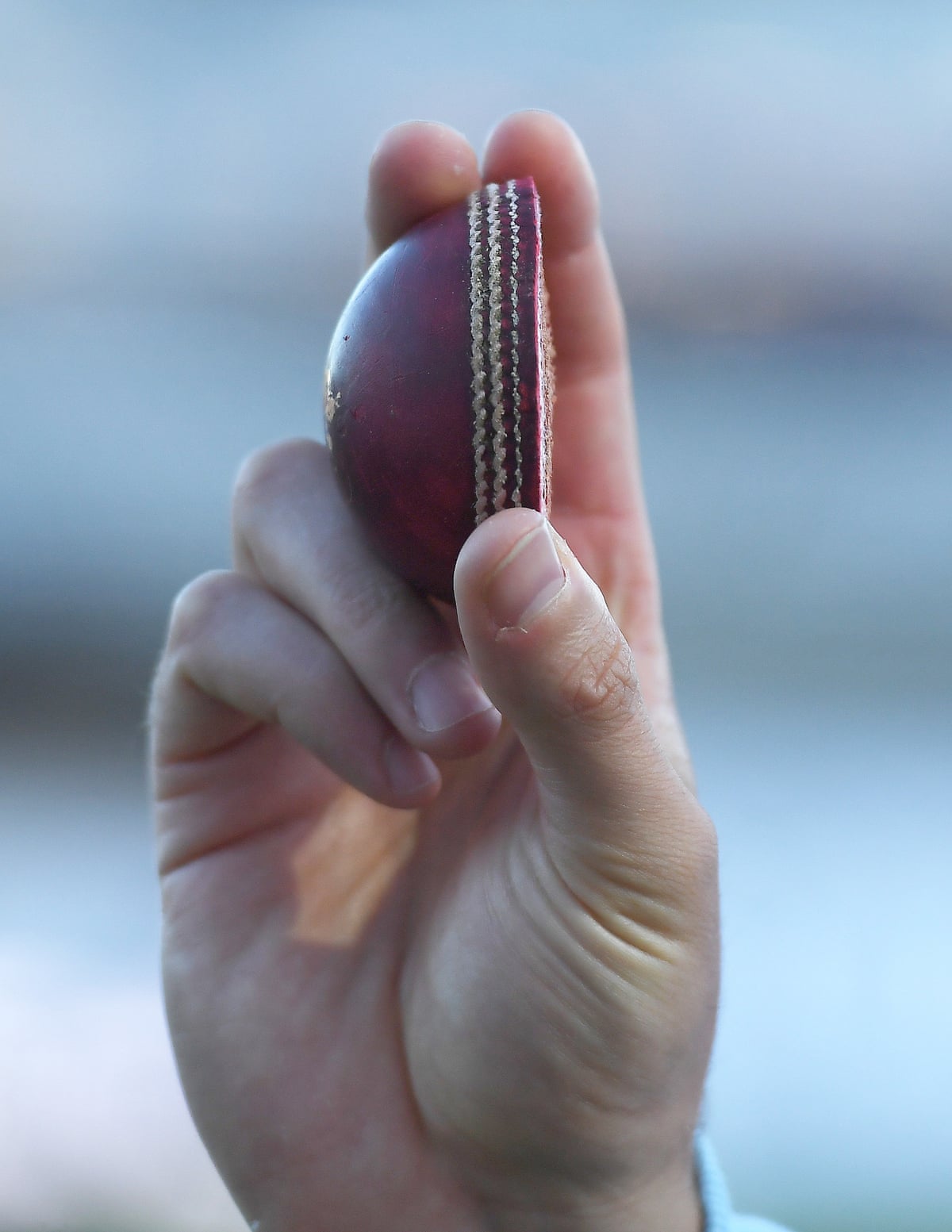 Ollie Robinson holds up his half of the match ball after day one of the first Test between England and Pakistan.