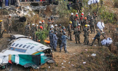 Rescuers inspect the site of the Yeti Airlines plane crash in Nepal.