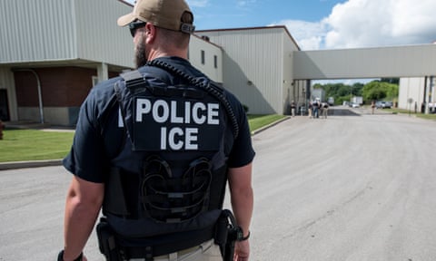 US Immigration and Customs Enforcement (Ice) special agent preparing to arrest immigrants at Fresh Mark, in Salem, on 19 June.