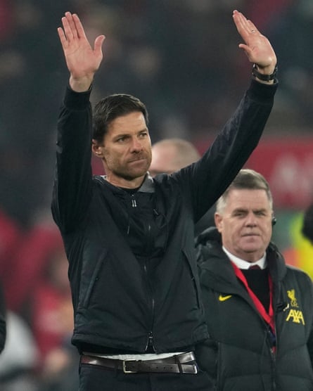 Bayer Leverkusen’s head coach Xabi Alonso waves to the crowd at the end of the Champions League defeat to Liverpool.