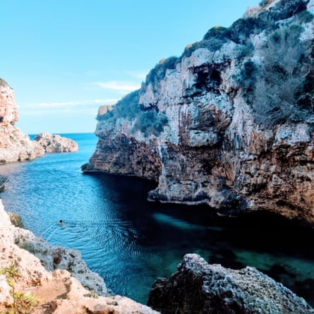 The writer swimming in a cove off the Camí de Cavalls trail, Menorca