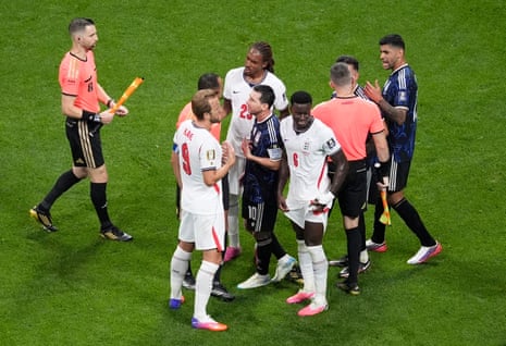 Lionel Messi confronts the referee at half-time.