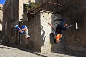 Syrian youths practice parkour in Aleppo.