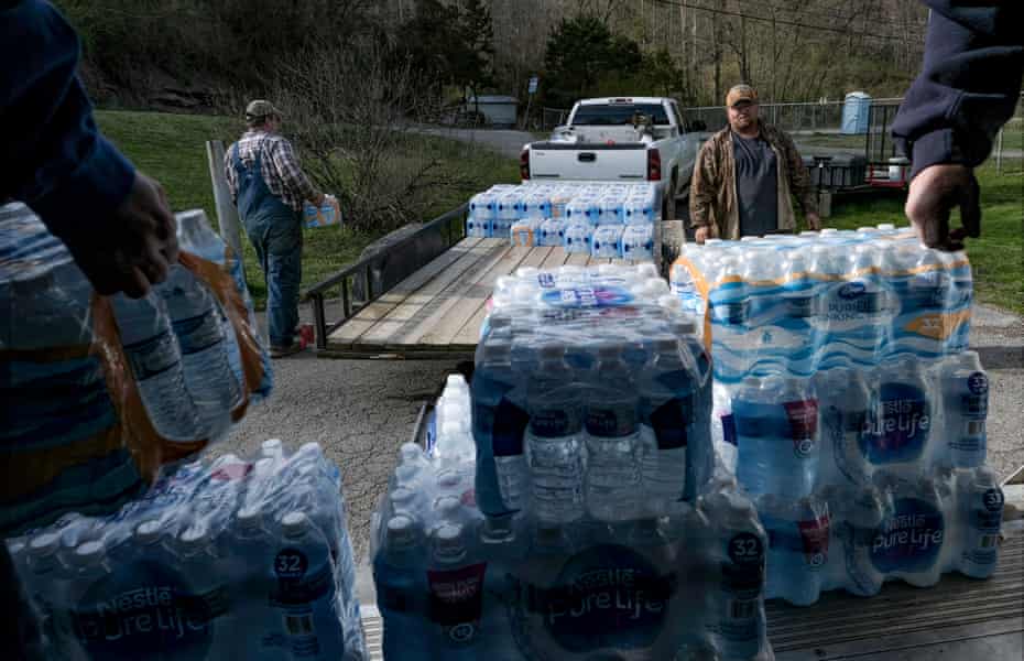 People pick up donated water to share with Martin County community members in Huntleyville, KY on April 1, 2019.